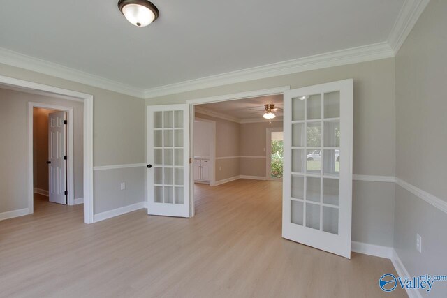 119 Victoria Dr, Madison, AL 35758 - empty room featuring french doors, crown molding, light wood-type flooring, and baseboards