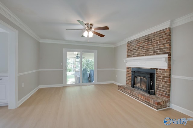 unfurnished living room featuring ornamental molding, light wood-type flooring, a fireplace, and ceiling fan