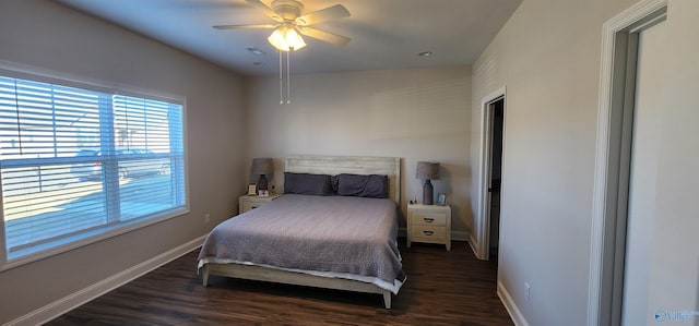 bedroom with ceiling fan and dark hardwood / wood-style flooring