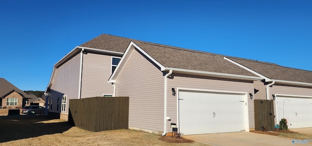 view of side of home with a garage