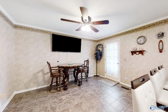 dining area with ornamental molding and ceiling fan