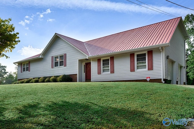 view of front of house featuring a front yard and a garage