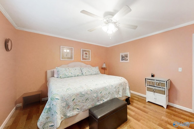 bedroom with ornamental molding, ceiling fan, and light hardwood / wood-style flooring