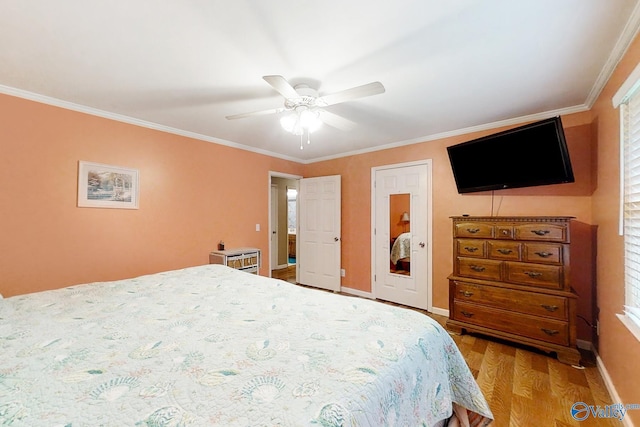 bedroom featuring ceiling fan, light hardwood / wood-style flooring, and ornamental molding