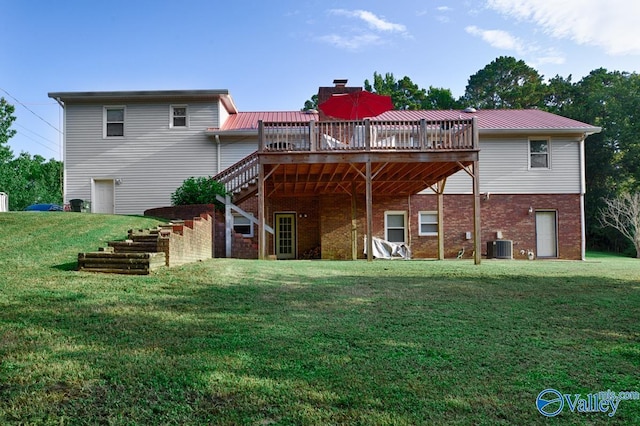 back of property with central AC, a yard, and a wooden deck