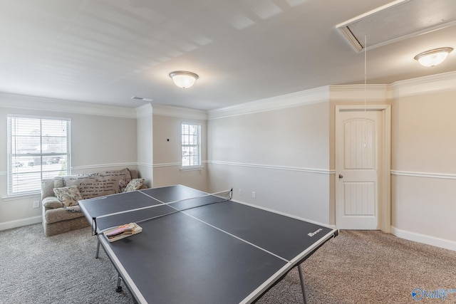 recreation room featuring ornamental molding and carpet flooring