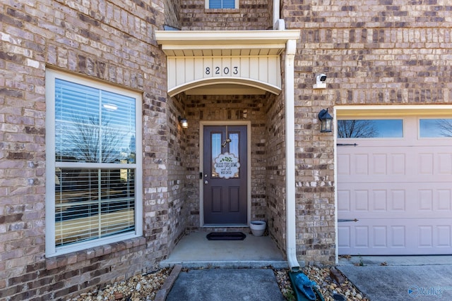 view of exterior entry featuring a garage