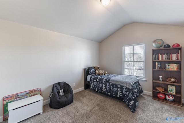 carpeted bedroom with vaulted ceiling