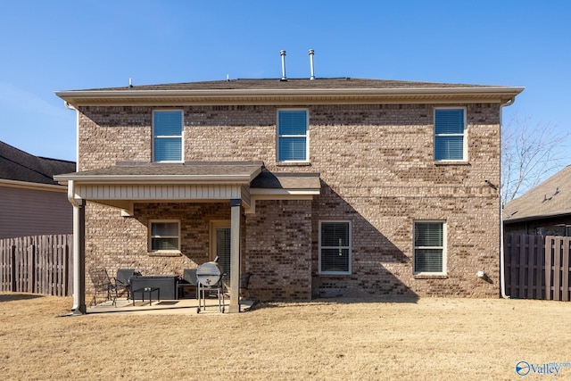 back of property featuring a patio area