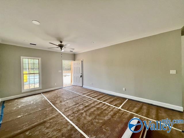 spare room with ceiling fan and ornamental molding