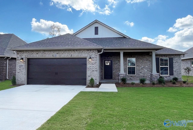 view of front facade featuring a garage and a front lawn