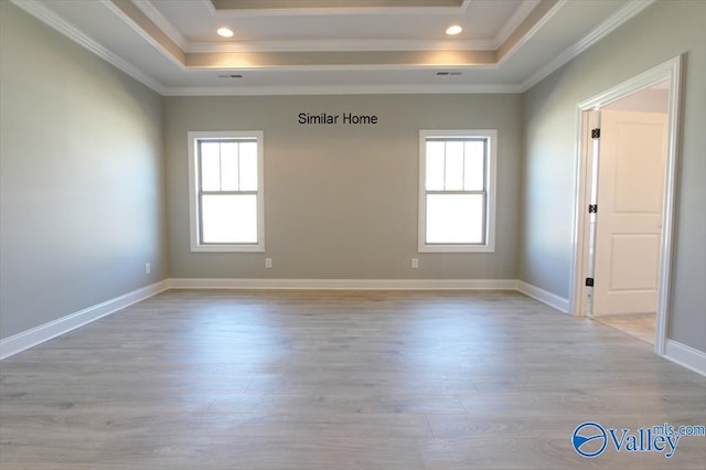 HIGHPOINTB2 Mallard Dr, Madison, AL 35756 - empty room featuring a tray ceiling, light wood-type flooring, crown molding, and recessed lighting