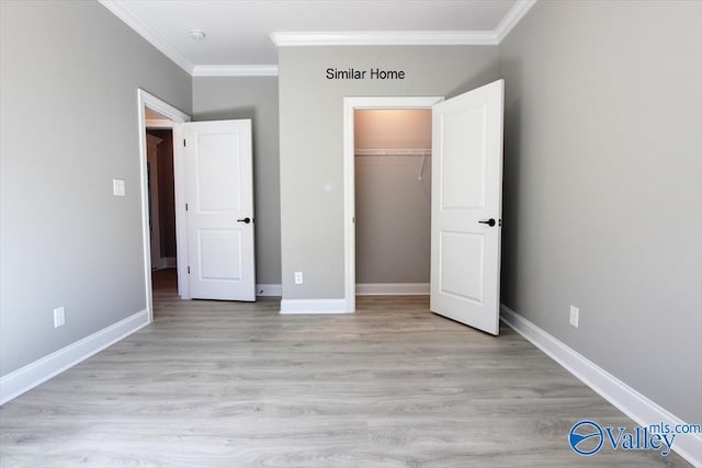 HIGHPOINTB2 Mallard Dr, Madison, AL 35756 - unfurnished bedroom with ornamental molding, light wood finished floors, and a closet
