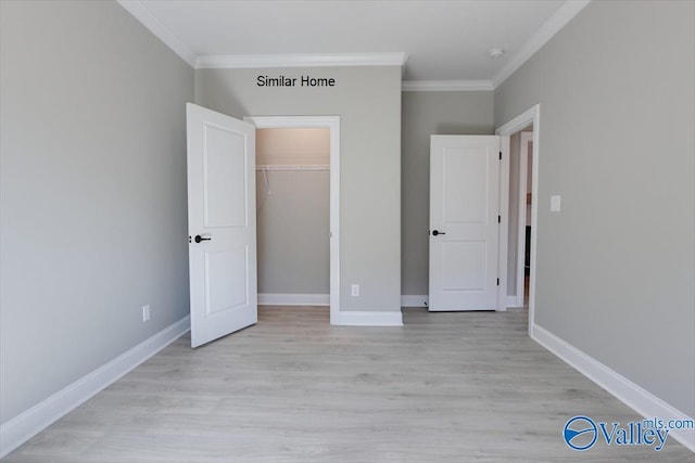 HIGHPOINTB2 Mallard Dr, Madison, AL 35756 - unfurnished bedroom with crown molding, light wood finished floors, and a closet