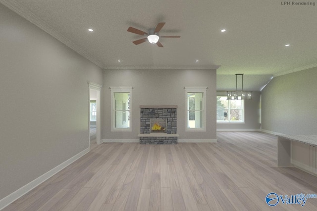 HIGHPOINTB2 Mallard Dr, Madison, AL 35756 - unfurnished living room featuring light wood-type flooring, a fireplace, a ceiling fan, recessed lighting, and crown molding