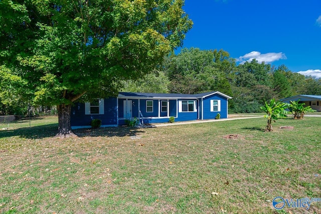 ranch-style house with a front lawn