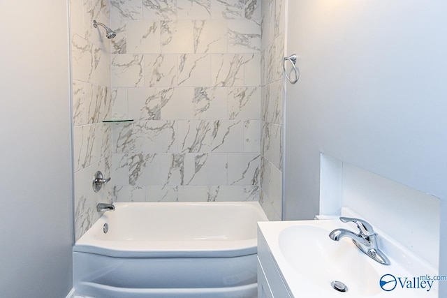 bathroom featuring vanity and tiled shower / bath combo