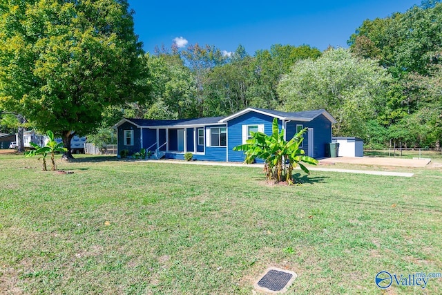 ranch-style house with a porch, a front lawn, and a garage