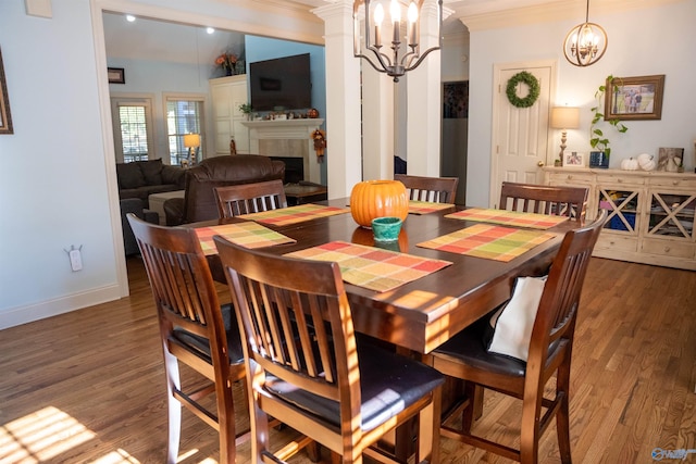 dining space featuring ornamental molding and dark hardwood / wood-style flooring