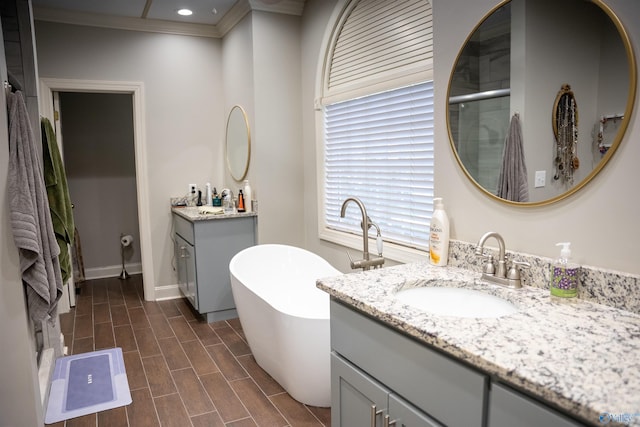 bathroom with wood-type flooring, crown molding, vanity, and independent shower and bath