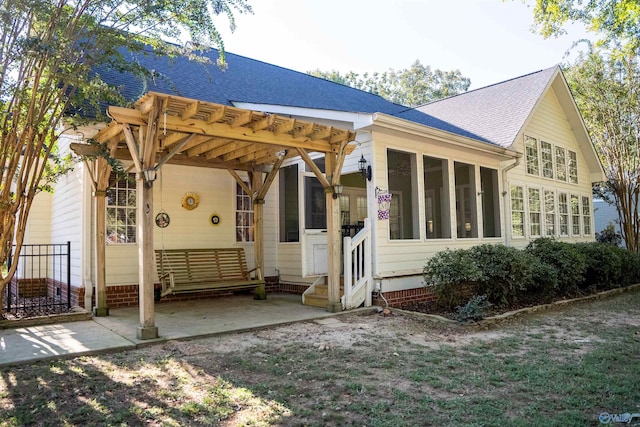 back of house with a patio area and a pergola