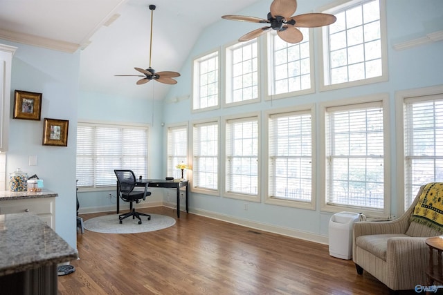 office featuring dark hardwood / wood-style floors, ornamental molding, and ceiling fan