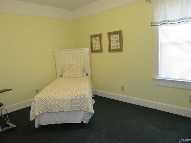 bedroom featuring dark colored carpet