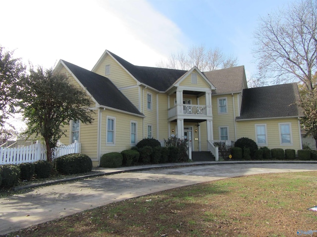 view of front of property with a balcony