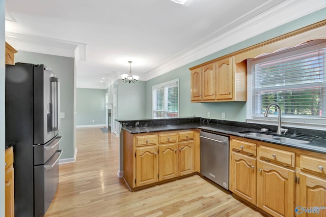 133 Raccoon Trce, Huntsville, AL 35806 - kitchen with appliances with stainless steel finishes, a peninsula, a chandelier, light wood-type flooring, and ornamental molding