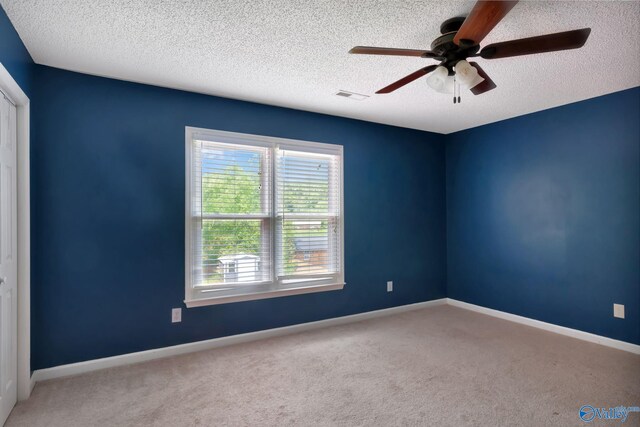 133 Raccoon Trce, Huntsville, AL 35806 - carpeted spare room with a textured ceiling and ceiling fan