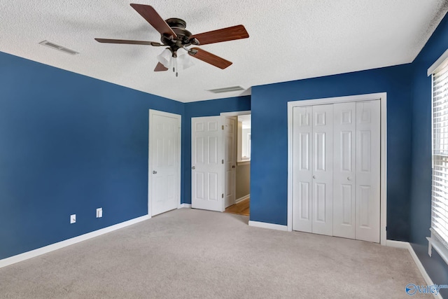 133 Raccoon Trce, Huntsville, AL 35806 - unfurnished bedroom with a textured ceiling, carpet, and a ceiling fan