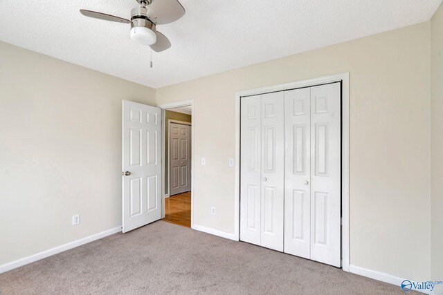 133 Raccoon Trce, Huntsville, AL 35806 - unfurnished bedroom featuring carpet floors, a closet, and a ceiling fan