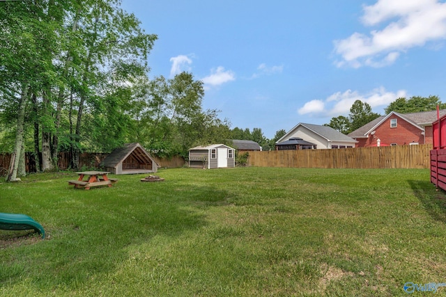 133 Raccoon Trce, Huntsville, AL 35806 - fenced backyard featuring a shed and a fire pit