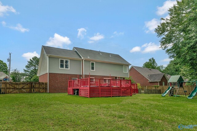 133 Raccoon Trce, Huntsville, AL 35806 - rear view of house with a fenced backyard, a deck, a playground, and brick siding