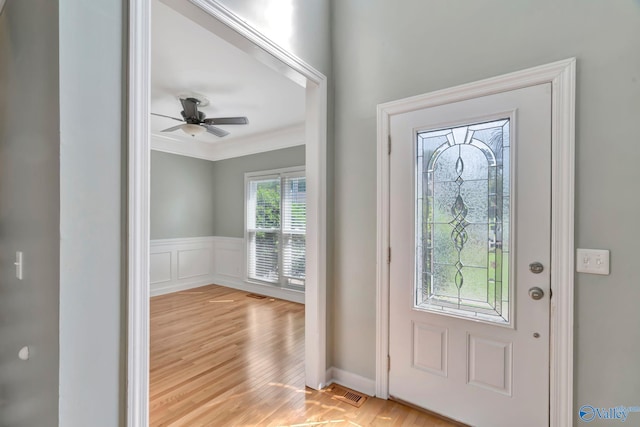 133 Raccoon Trce, Huntsville, AL 35806 - foyer entrance featuring crown molding, wainscoting, wood finished floors, and ceiling fan