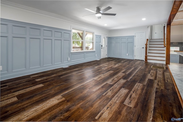 unfurnished living room featuring crown molding, dark hardwood / wood-style floors, and ceiling fan