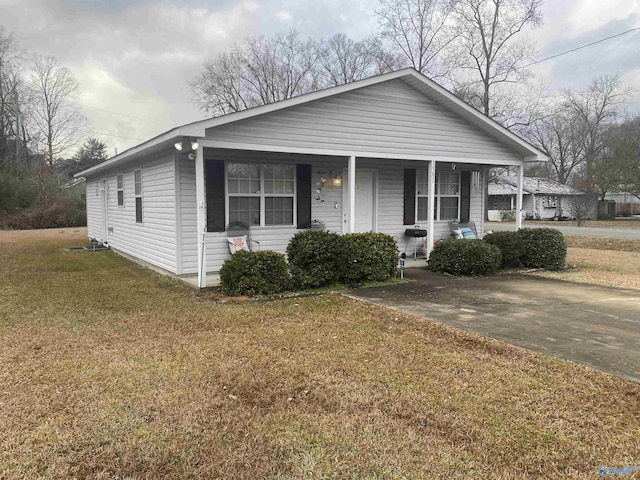 view of front of home with a front lawn and a porch