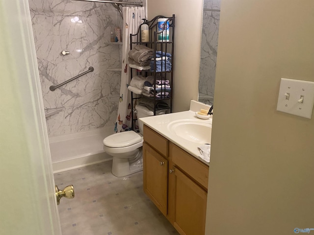 bathroom with toilet, vanity, and walk in shower