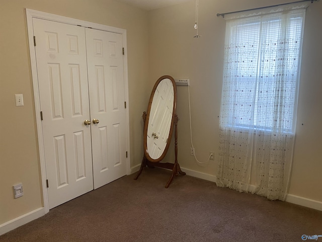 unfurnished bedroom featuring a closet and carpet