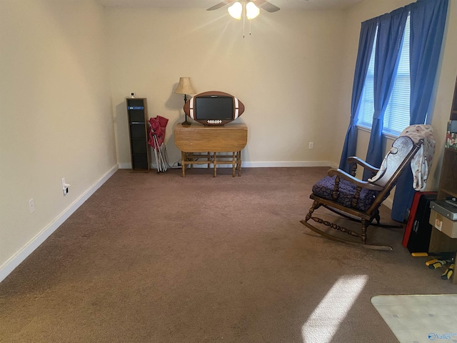 living area featuring ceiling fan and carpet flooring