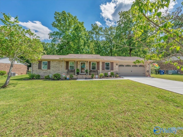 ranch-style house featuring a garage, covered porch, concrete driveway, and a front lawn