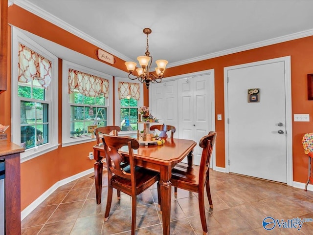 tiled dining space with a chandelier, ornamental molding, and baseboards