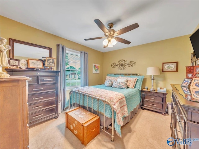bedroom with light carpet and ceiling fan