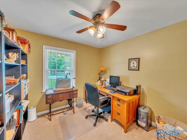 office featuring ceiling fan, light colored carpet, and baseboards