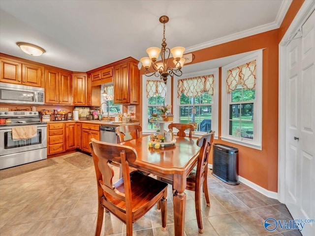 dining space with a chandelier, crown molding, light tile patterned floors, and baseboards