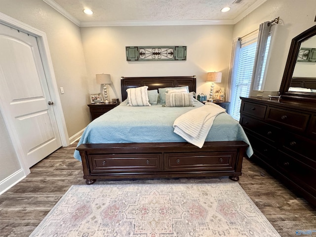 bedroom featuring crown molding, dark hardwood / wood-style floors, and a textured ceiling