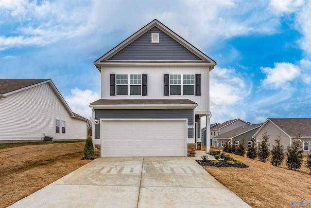 front facade featuring a front yard and a garage