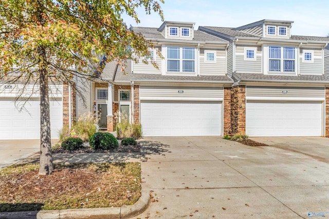 232 Falling Water Ln, Madison, AL 35756 - townhome / multi-family property with a garage, driveway, and roof with shingles