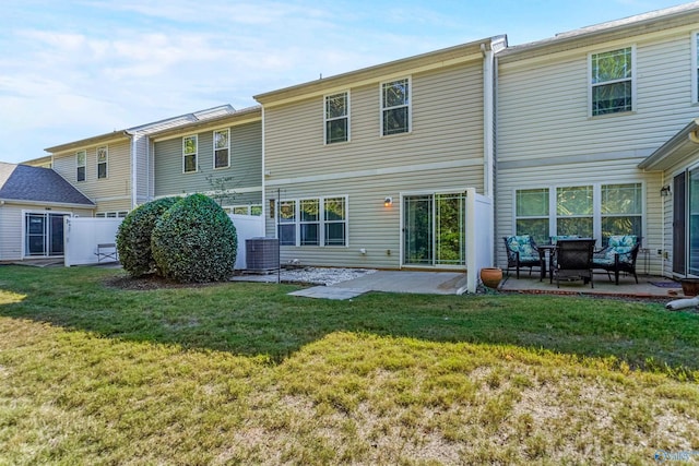 back of house featuring a patio area, central AC, and a lawn