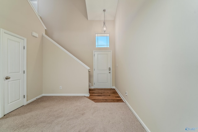 232 Falling Water Ln, Madison, AL 35756 - carpeted foyer with a high ceiling, baseboards, and stairway